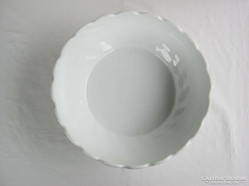 A large ceramic bowl with a violet pattern