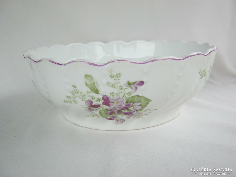 A large ceramic bowl with a violet pattern