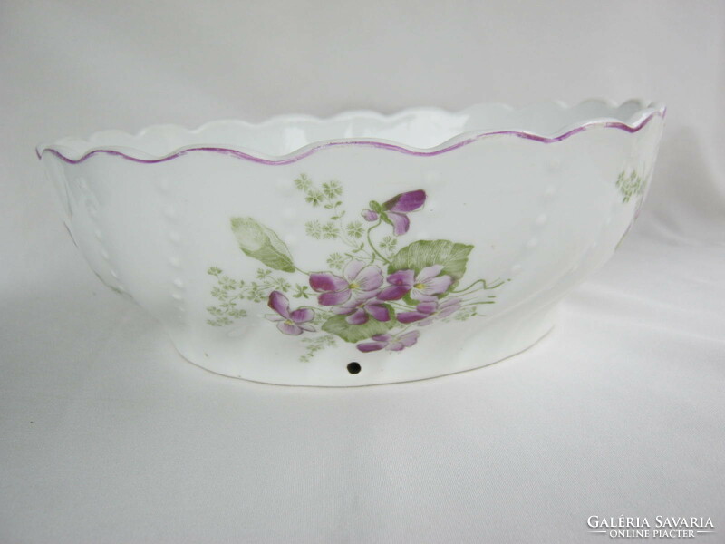 A large ceramic bowl with a violet pattern