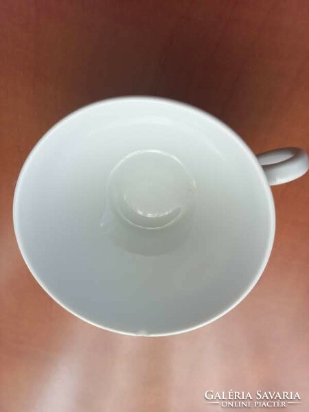 White porcelain tea cup - damaged