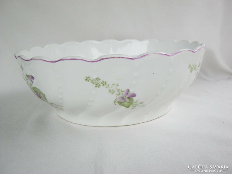 A large ceramic bowl with a violet pattern