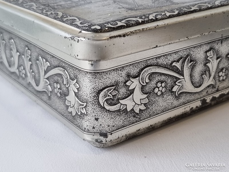 Old patinated embossed metal biscuit boxes