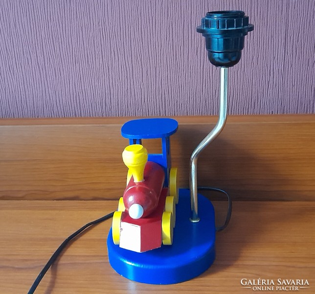 Children's table lamp with a wooden locomotive