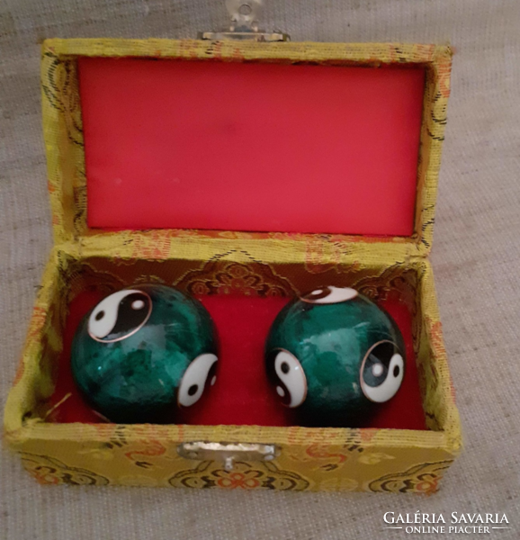 Balls encrusted with qigong fire enamel in preserved condition with jing.Jang symbol on them in a box