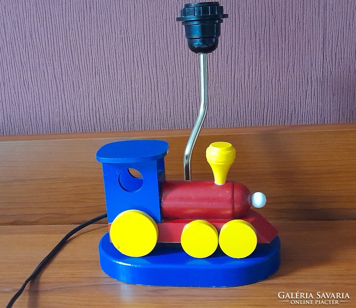 Children's table lamp with a wooden locomotive