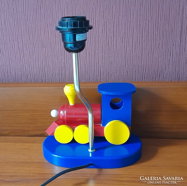 Children's table lamp with a wooden locomotive