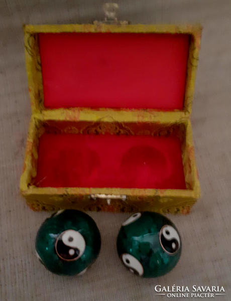 Balls encrusted with qigong fire enamel in preserved condition with jing.Jang symbol on them in a box