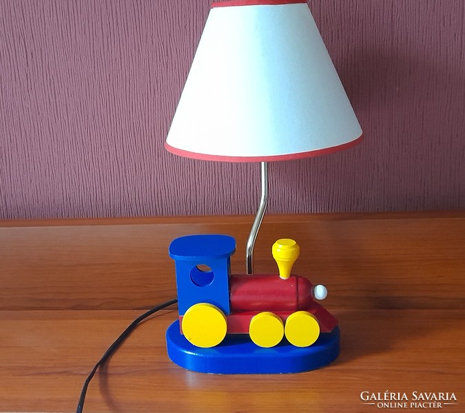 Children's table lamp with a wooden locomotive