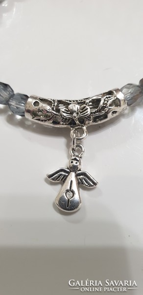 Elegant faceted glass bracelet with angel ornament