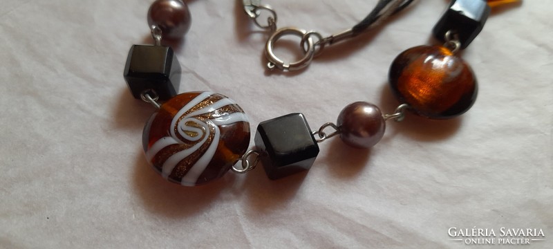 Necklace with brown glass lamp beads and plastic beads