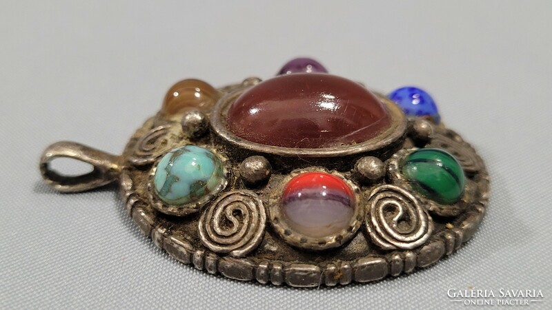 Silver-plated (miracle) pendant with semi-precious stones.