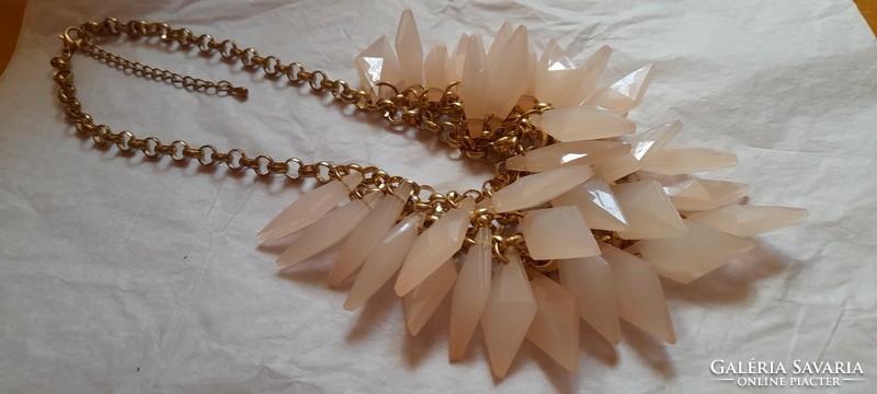 Very showy necklace with pink decorations and spikes
