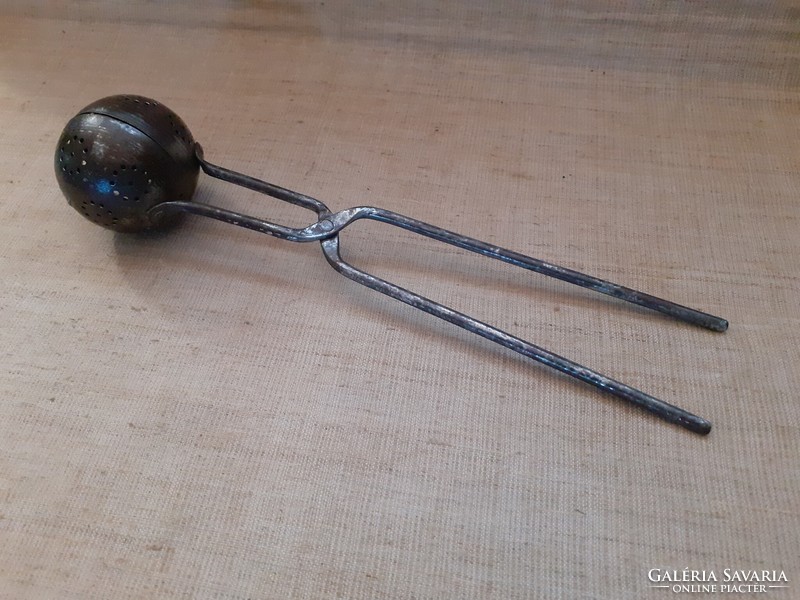 Old snowball baking spoon with wrought iron handle