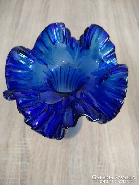 Blue funnel vase made of glass with ruffled edges