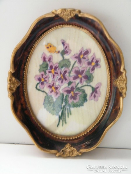Vintage embroidered bouquet of pansies in an oval picture frame