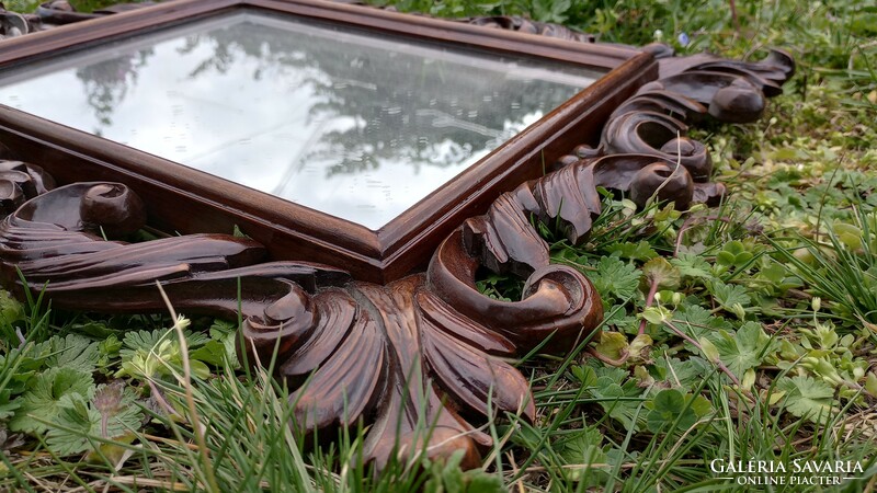 Mirror with carved frame
