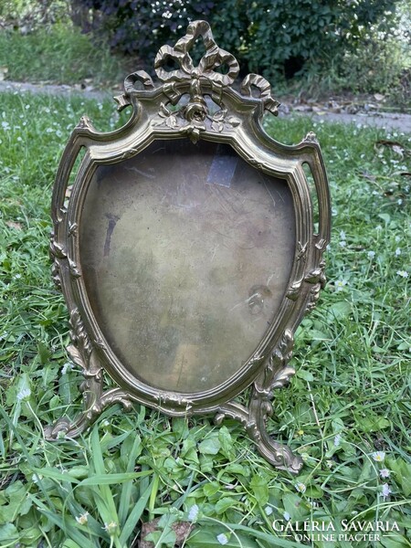 Old bowed copper picture frame