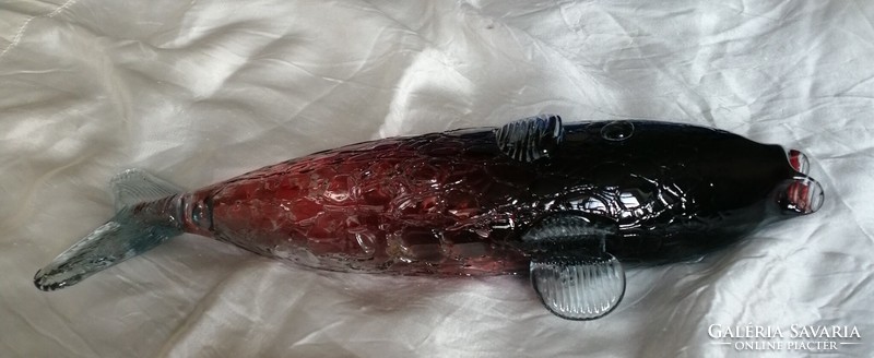 A special, convex, burgundy glass fish