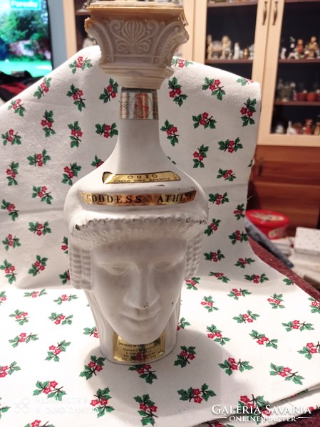 A glass bottle with two faces is an interesting, unique piece