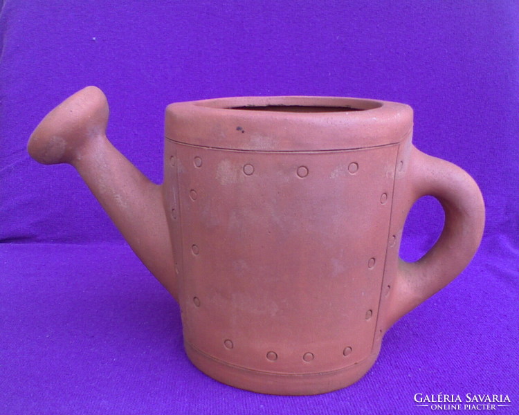 Unglazed ceramic watering can