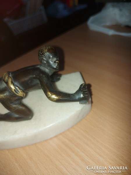 Antique copper statue on a marble base
