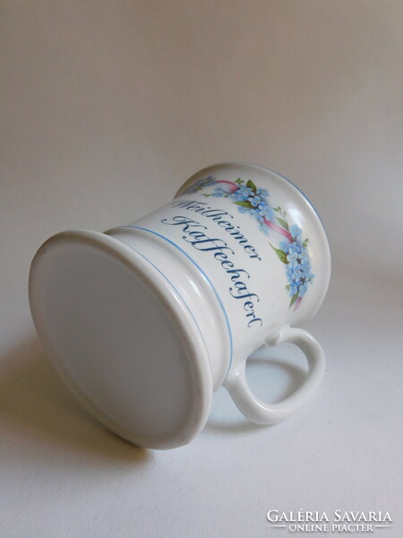 Old mug with forget-me-not pattern