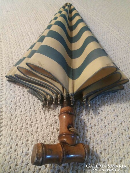 Old, wooden, striped women's umbrella
