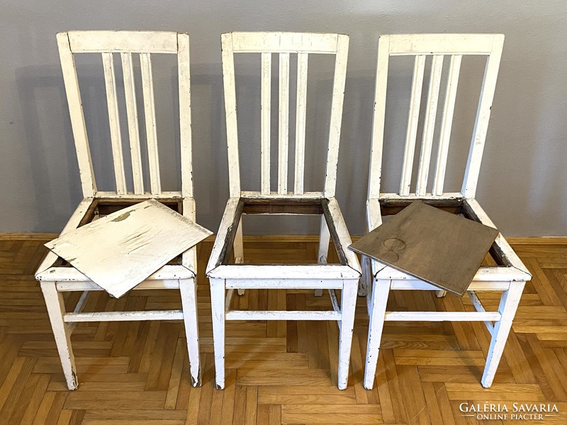 3 white high-back elegant dining chairs