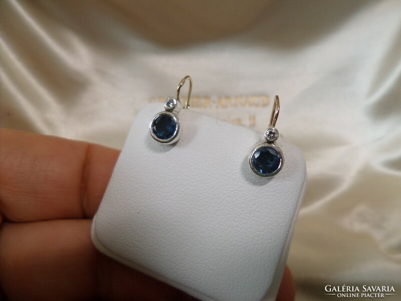 Antique gold buton earrings with a pair of blue sapphires and brils