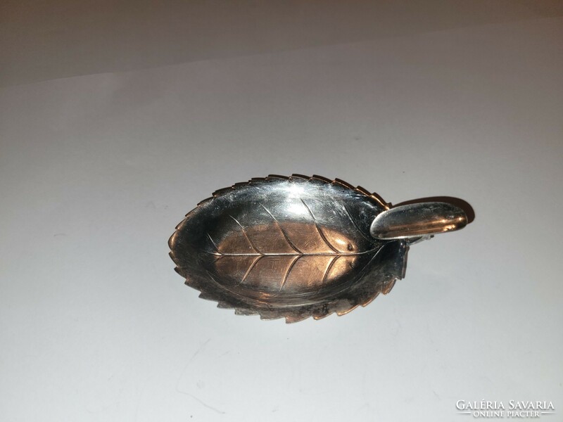 Silver ashtray in the shape of a leaf