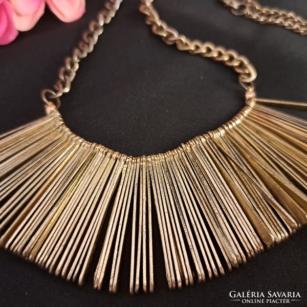 Gilded craftsman necklaces.