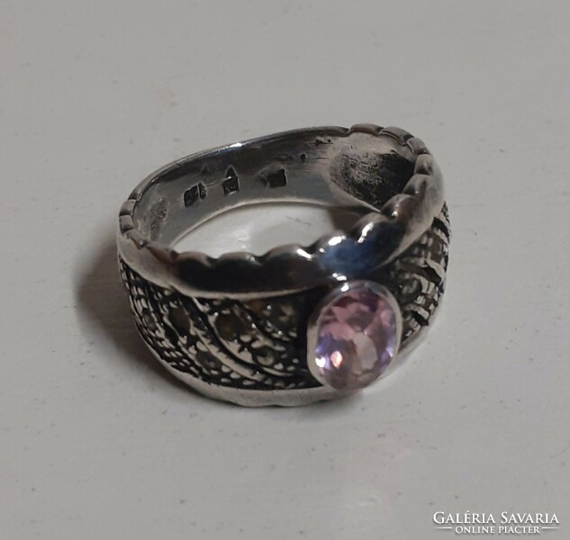 Antique hallmarked sterling silver openwork ring adorned with a polished set pink stone