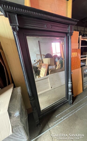 Large mirror in a richly worked frame