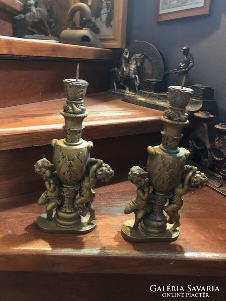 Pair of ceramic candle holders, putto, 24 cm high.