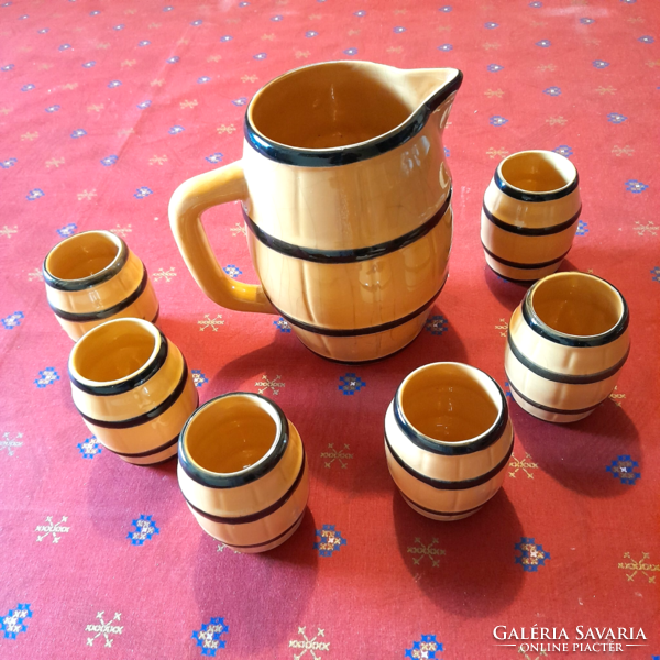 Old barrel-shaped ceramic wine jug and glass set