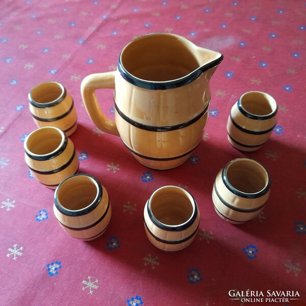 Old barrel-shaped ceramic wine jug and glass set