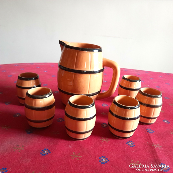 Old barrel-shaped ceramic wine jug and glass set