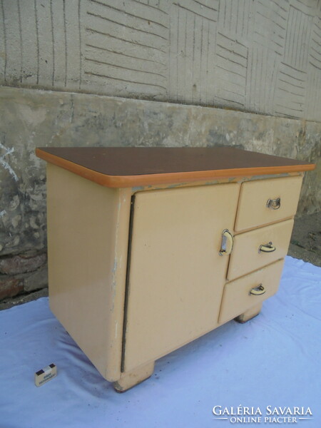 Small kitchen cabinet with old drawers and shelves