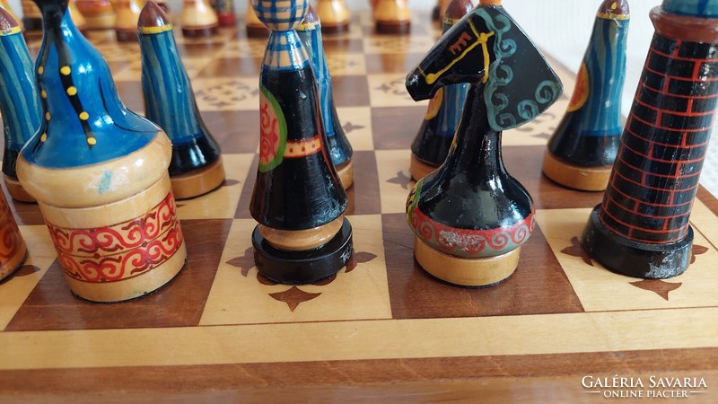 Carved and painted chess set with board in nice condition