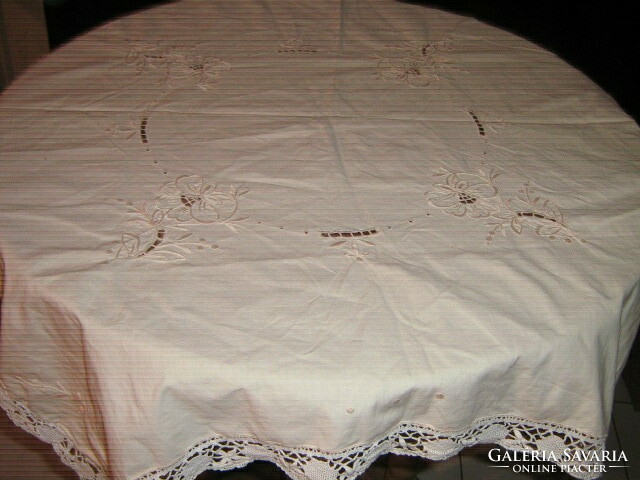 Beautiful vintage rosette tablecloth with a lace edge