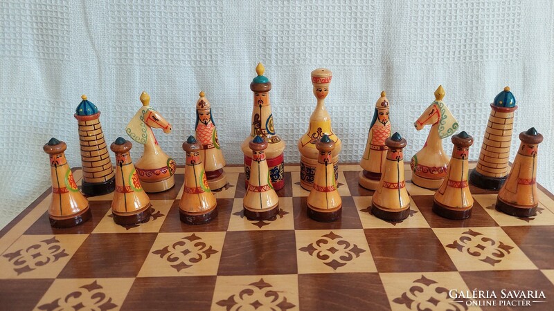 Carved and painted chess set with board in nice condition