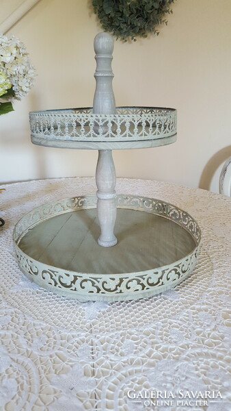 A huge wooden/metal two-level serving table, in the middle of the table