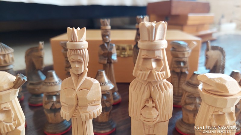 Carved human figure chess set