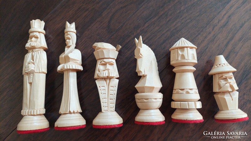 Carved human figure chess set