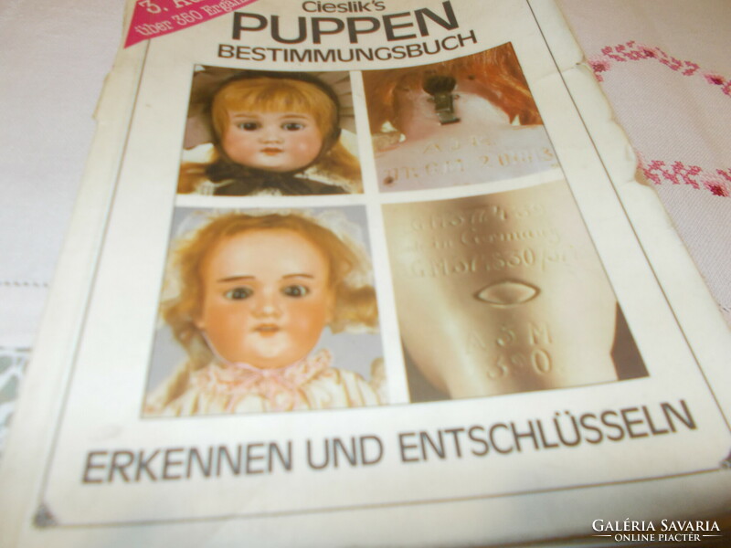 Old baby books about porcelain-headed dolls, celluloid and pulp dolls