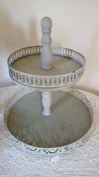 A huge wooden/metal two-level serving table, in the middle of the table