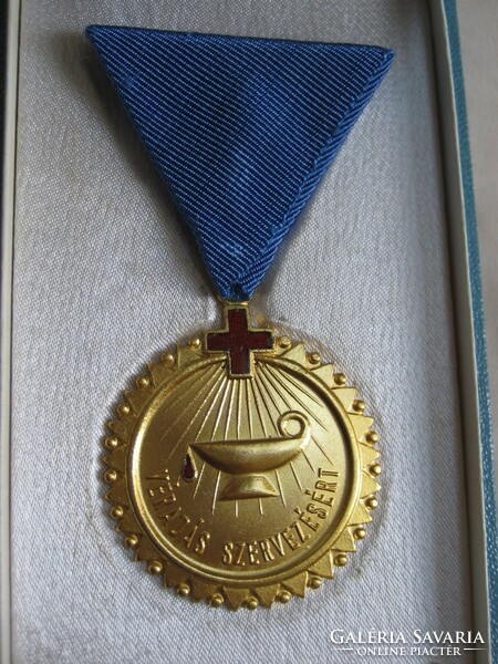 Gold award and badge for organizing blood donation