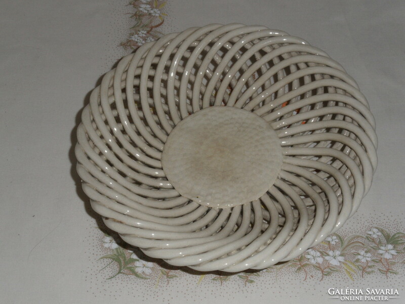 Older porcelain bowl with openwork edges, offering