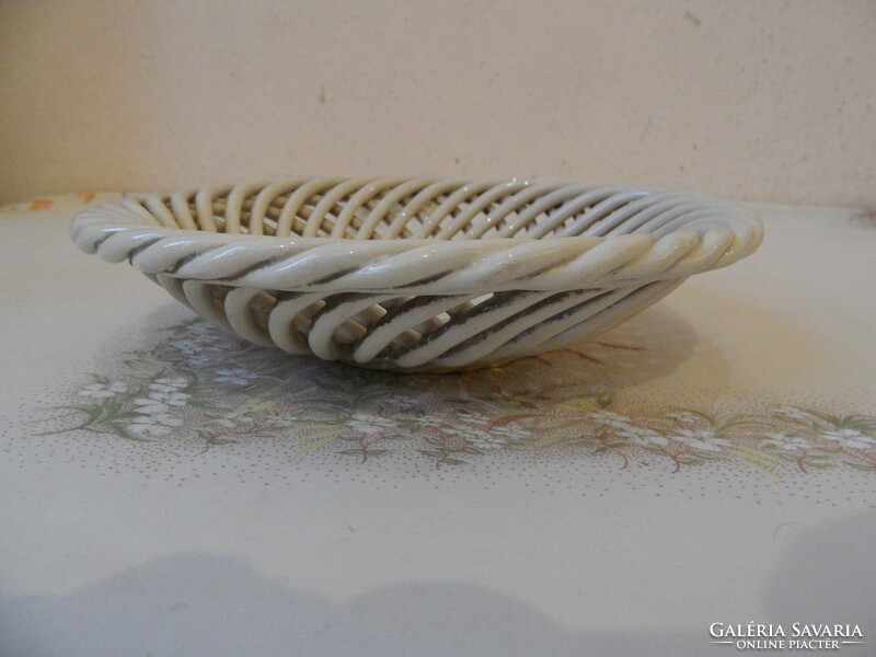 Older porcelain bowl with openwork edges, offering