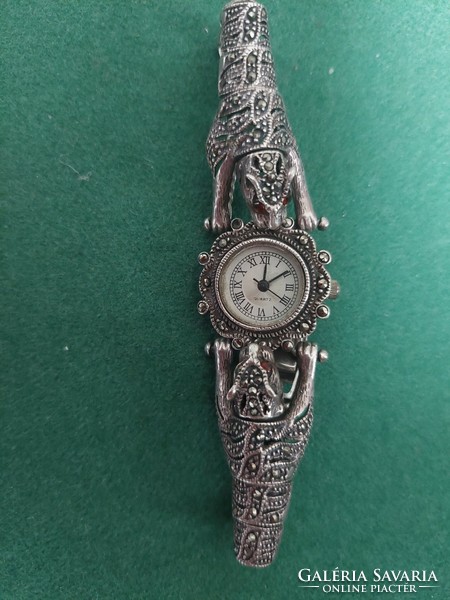 Silver watch with an animal figure